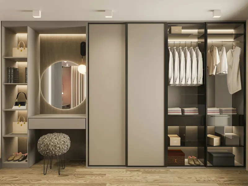 Closet com penteadeira e espelho redondo, portas de correr e vitrine de vidro iluminada
