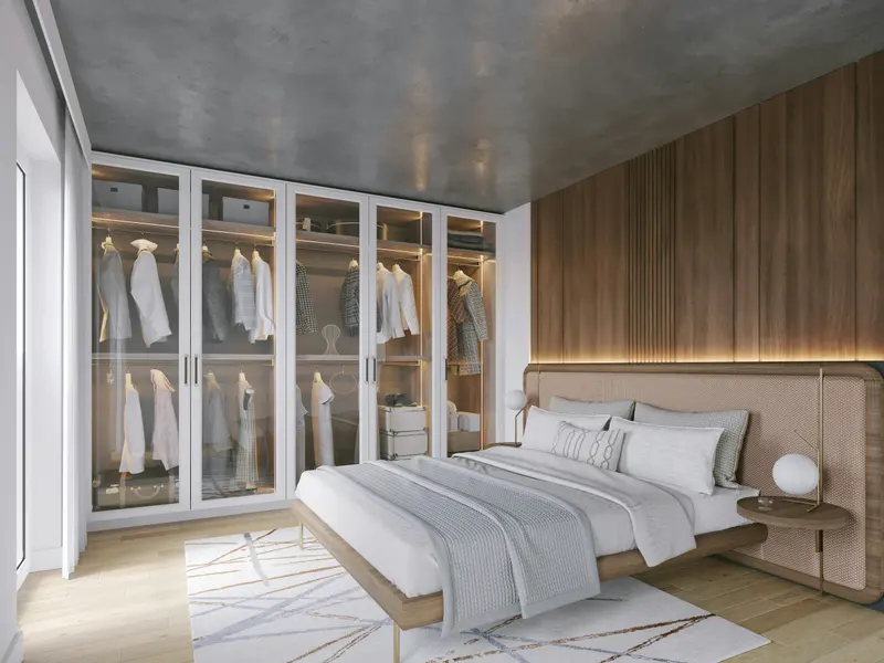 Quarto de casal com roupeiro de portas de vidro iluminado e painel de madeira na cabeceira